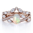 thumbnail image 1 of JeenMata Chevron Bezel 1.75 carat Ovate Welo Opal And Moissanite Infinity Pave-Channel Wedding Ring Set In 18K Rose Gold Plating Over Silver, 1 of 6