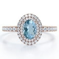 thumbnail image 1 of JeenMata Double Cluster 1.35 Carat Egg Shaped Ocean Blue Created Aquamarine and Moissanite Pave Set Engagement Ring in 18K Rose Gold Plating over Silver, 1 of 6
