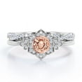 thumbnail image 1 of JeenMata Flower Halo Bezel 1.5 Carat Round Cut Pinky Peach created morganite and Moissanite Infinity Twisted Band Wedding Ring Set in 18K White Gold Plating over Silver, 1 of 6