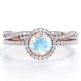 thumbnail image 1 of JeenMata Four-Prong Halo Setting 1.75 Carat Round Brilliant Cut Blue Moonstone and Moissanite Pave Infinity Bridal Ring Set in 18K Rose Gold Plating over Silver, 1 of 6