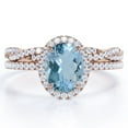 thumbnail image 1 of JeenMata Pave Halo Setting 1.75 Carat Oval Cut Light Blue Created Aquamarine And Moissanite Infinity Twisted Shank Bridal Set in 18K Rose Gold Plating over Silver, 1 of 6