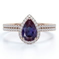 thumbnail image 1 of JeenMata Signature Halo 1.5 Carat Pear Cut Synthetic Alexandrite and Moissanite Half Eternity Wedding Ring Set in 18k Rose Gold over Silver, 1 of 4