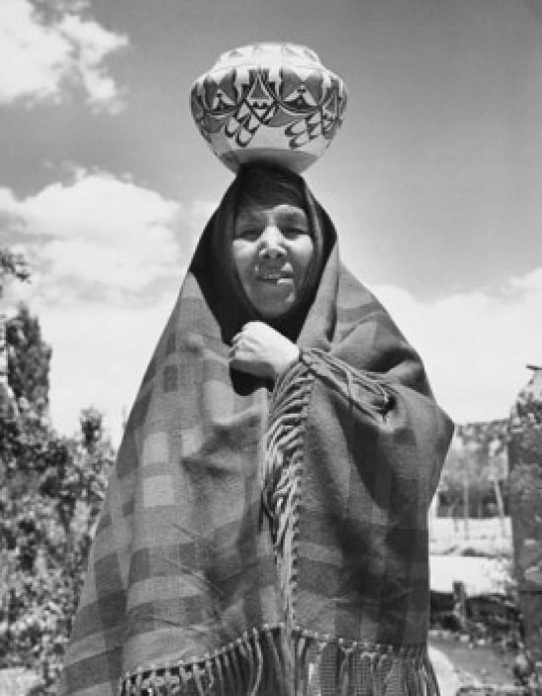 Jemez woman standing with a pottery on her head Canvas Art - (18 x 24)