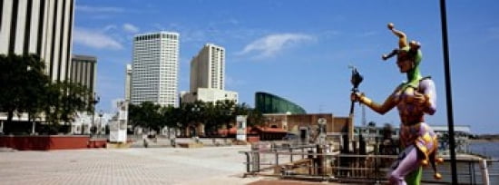 Jester statue with buildings in the background Riverwalk Area New Orleans Louisiana USA Canvas Art - Panoramic Images (36 x 13)