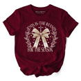 thumbnail image 1 of Jesus Is the Reason Christmas T‑Shirt, Coquette Gold Bow Cross Tee for Faithful Women, 1 of 11