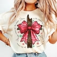 thumbnail image 1 of Jesus Is the Reason for the Season T-Shirt, Christian Cross & Coquette Bow Holiday Graphic, Faith‑Inspired Christmas Cheer Tee, 1 of 5