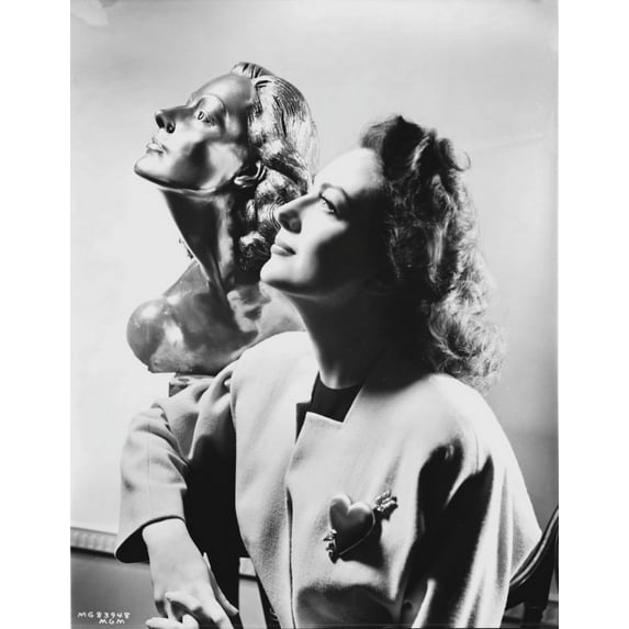 Joan Crawford posing beside a sculpture Photo Print (8 x 10)