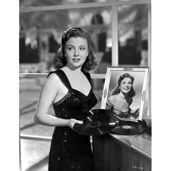 Joan Leslie on a Dress With Her Own Portrait in a Frame Photo Print (8 x 10)