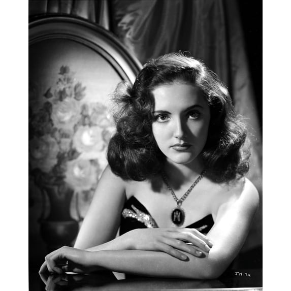 Joan Newton Leaning on a Table, wearing a Strapless Black Dress in Portrait Photo Print (8 x 10)