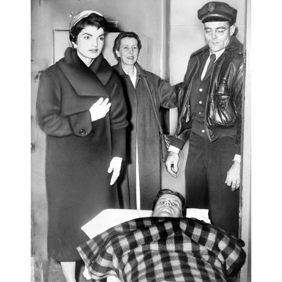 John F. Kennedy Leaving On Gurney From Hospital Following Spinal Surgery History (18 x 24)