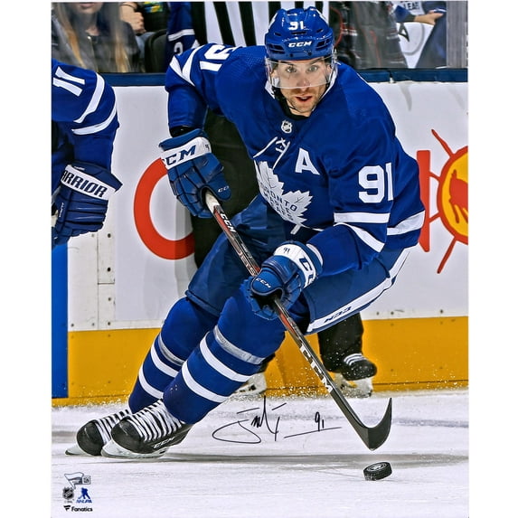John Tavares Toronto Maple Leafs Autographed 16" x 20" Blue Jersey Skating with Puck Photograph - Fanatics Authentic Certified