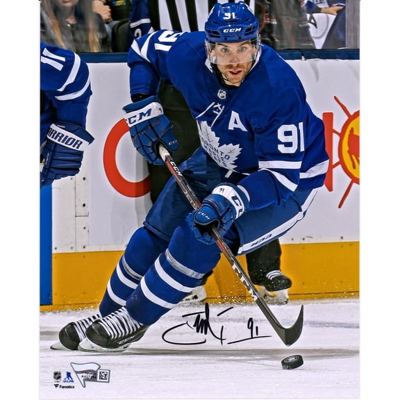 John Tavares Toronto Maple Leafs Autographed 8" x 10" Blue Jersey Skating with Puck Photograph - Fanatics Authentic Certified