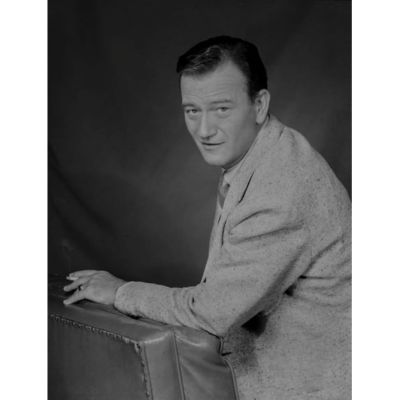 John Wayne Leaning on a Foam, wearing a Suit Photo Print (24 x 30)