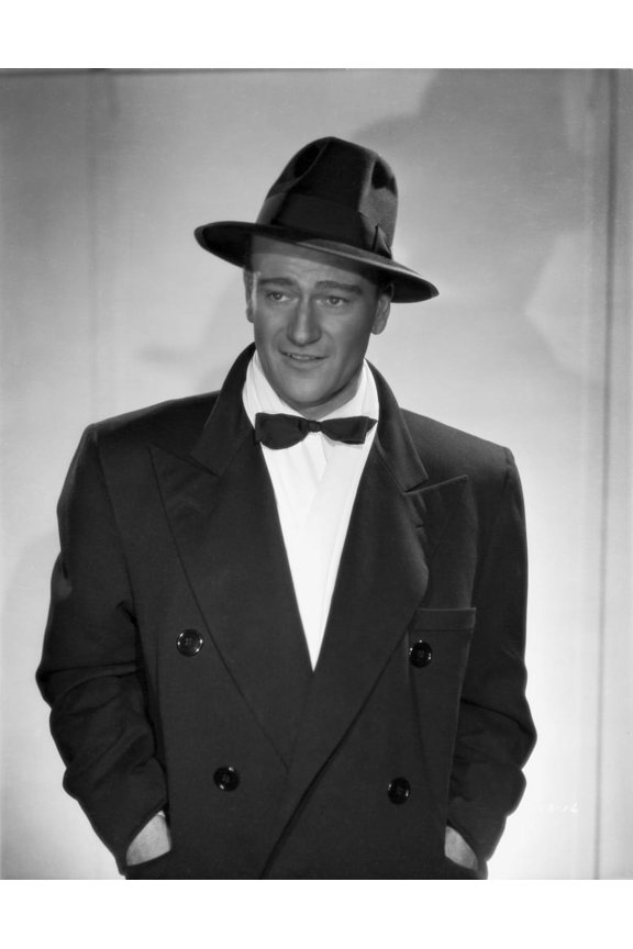John Wayne in a bowtie coat and hat Photo Print (8 x 10)