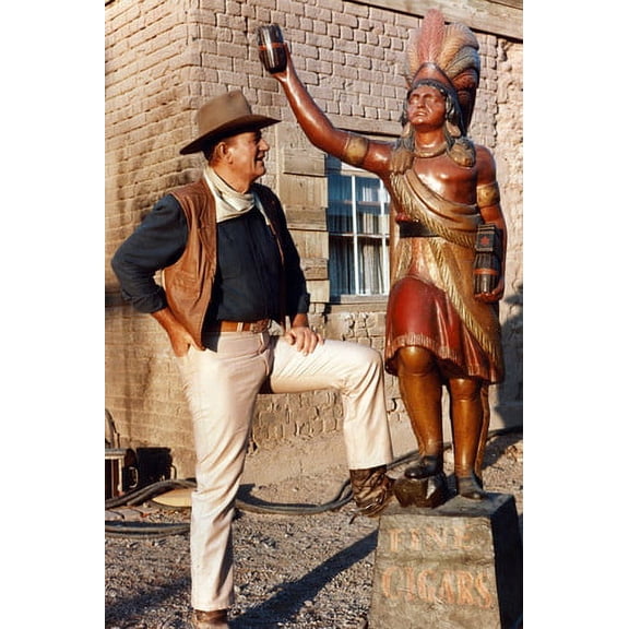 John Wayne smiling in western clothes looking at cigar store Indian 24x36 Poster