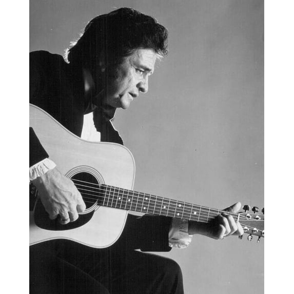 Johnny Cash poses in tuxedo holding his guitar 1980 5x7 inch photo