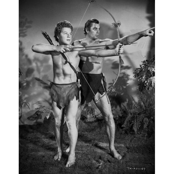 Johnny Weissmuller Leading a Young Man to Shoot His Arrow in a Classic Movie Scene Photo Print (24 x 30)