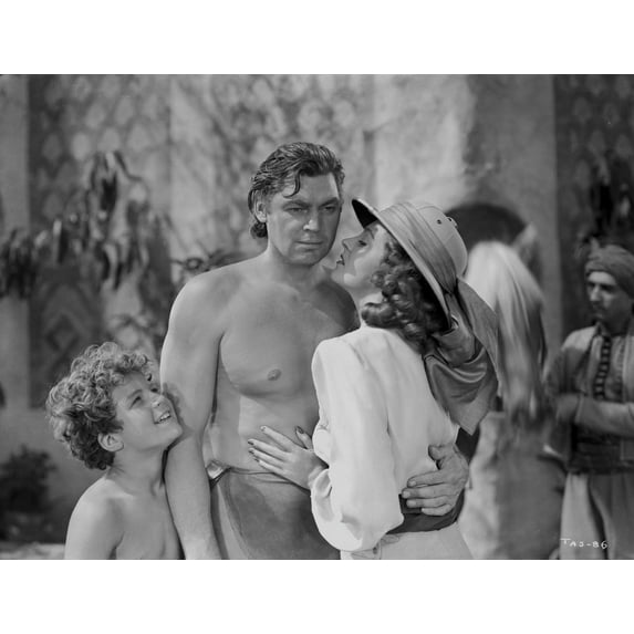 Johnny Weissmuller Receiving a Kiss from a City Girl in a Classic Movie Scene Photo Print (8 x 10)