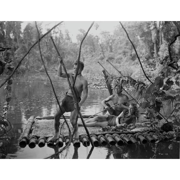 Johnny Weissmuller Riding a Raft with His Friends in a Classic Movie Scene Photo Print (8 x 10)