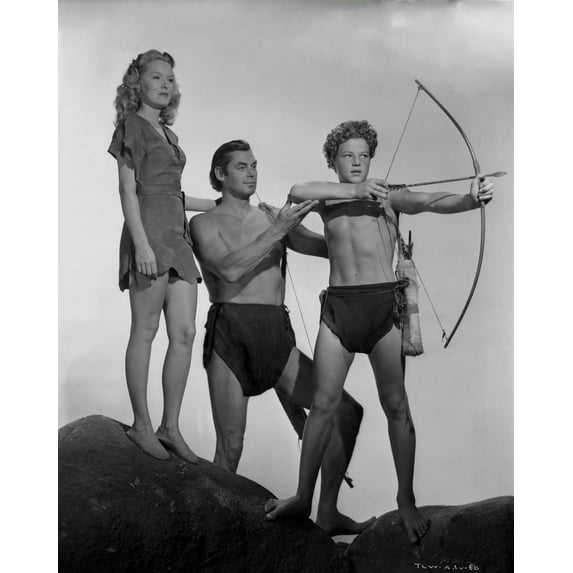 Johnny Weissmuller Teaching His Son to Use a Bow and Arrow with her Wife in a Classic Movie Scene Photo Print (8 x 10)