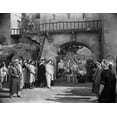 thumbnail image 1 of Johnny Weissmuller Walking with His Family in the Town in a Movie Scene Photo Print (24 x 30), 1 of 1