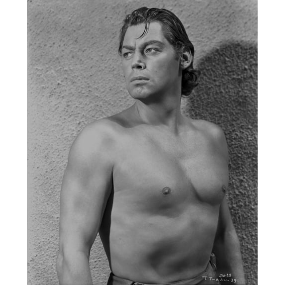 Johnny Weissmuller standing in Front of the Camera while Looking Away in a Portrait Photo Print (8 x 10)