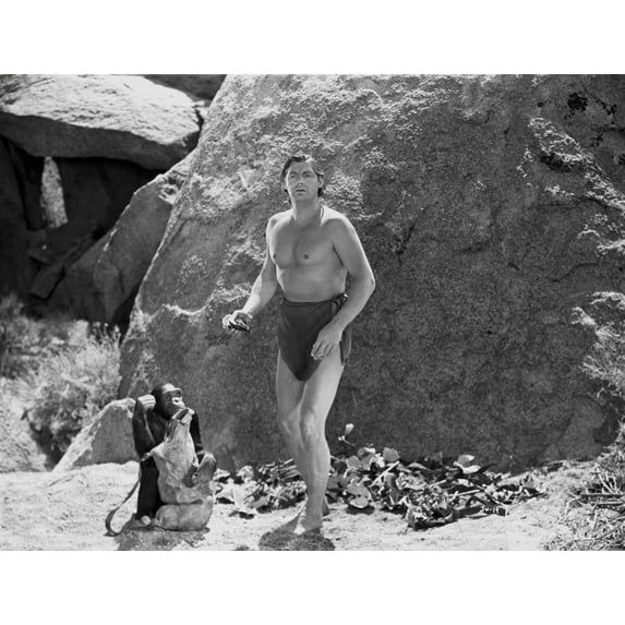 Johnny Weissmuller standing with a Monkey in a Classic Movie Scene Photo Print (8 x 10)
