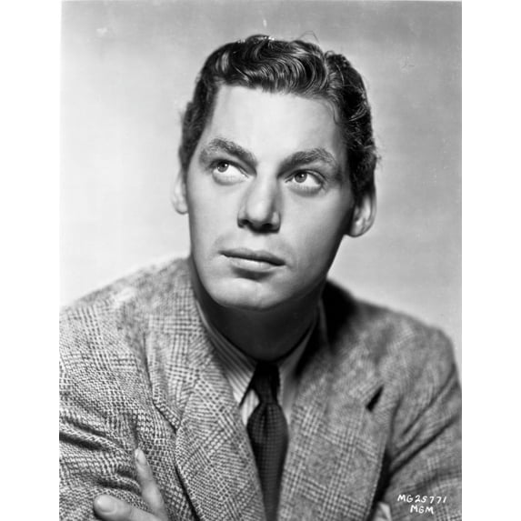 Johnny Weissmuller wearing a Suit and a Black Necktie while Looking Up Photo Print (8 x 10)