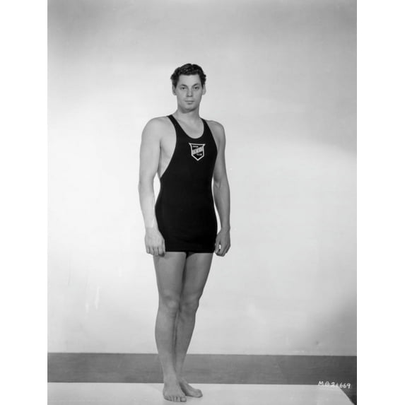 Johnny Weissmuller wearing a Swimming Attire and standing in a Portrait Photo Print (8 x 10)