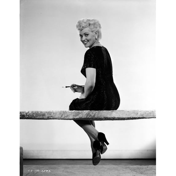 Judy Holliday sitting with Legs-Crossed Photo Print (8 x 10)
