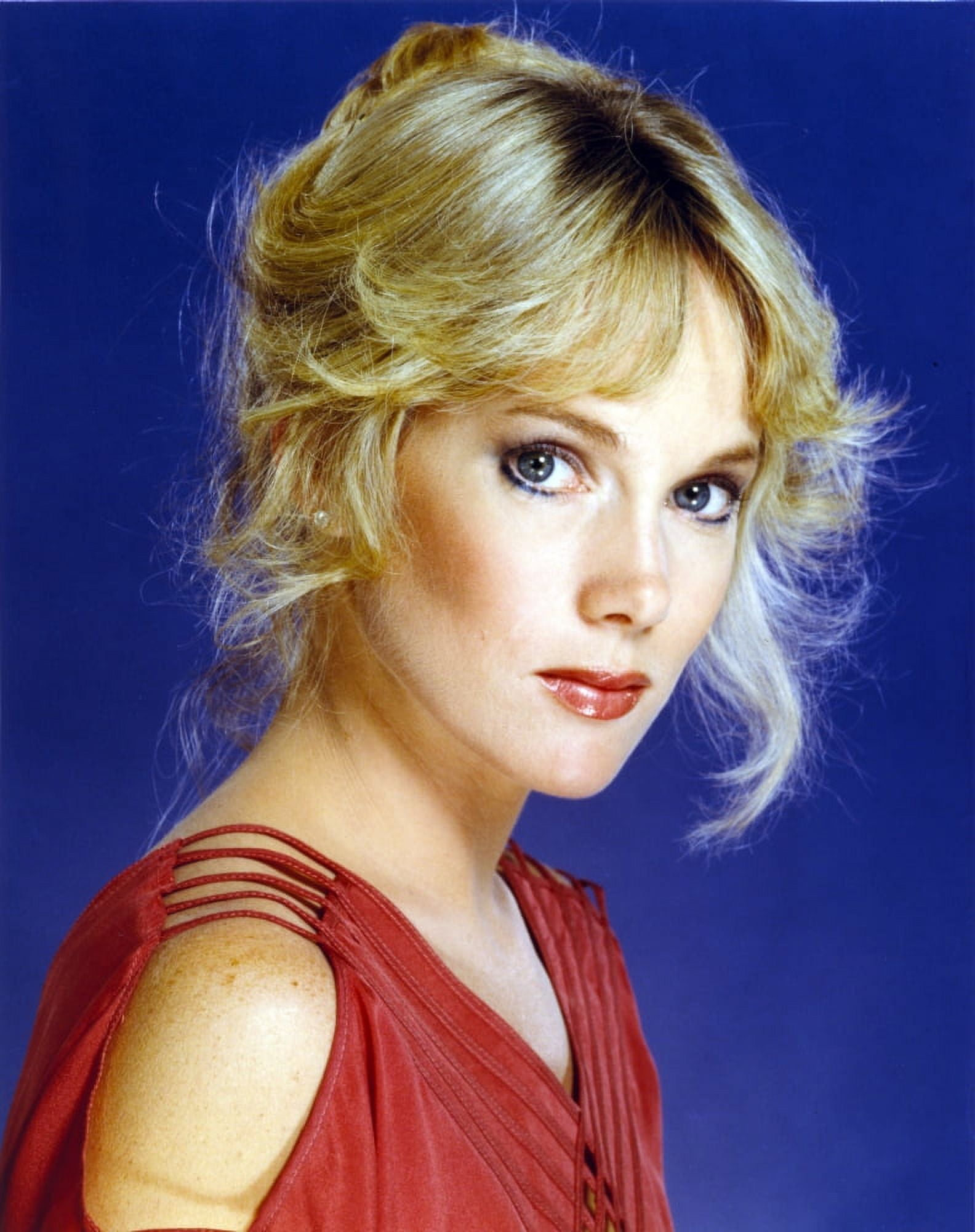 Julia Duffy wearing a Red Sleeveless Dress in a Close Up Portrait Photo