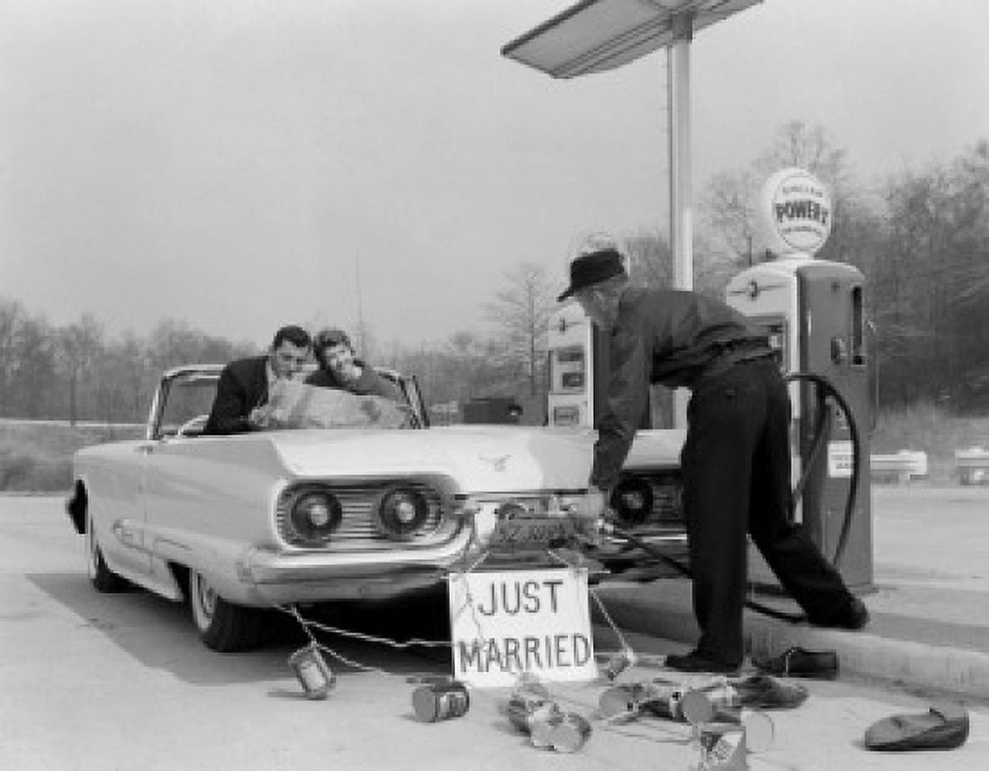 Just married couple on gas station reading map Canvas Art - (24 x 36)