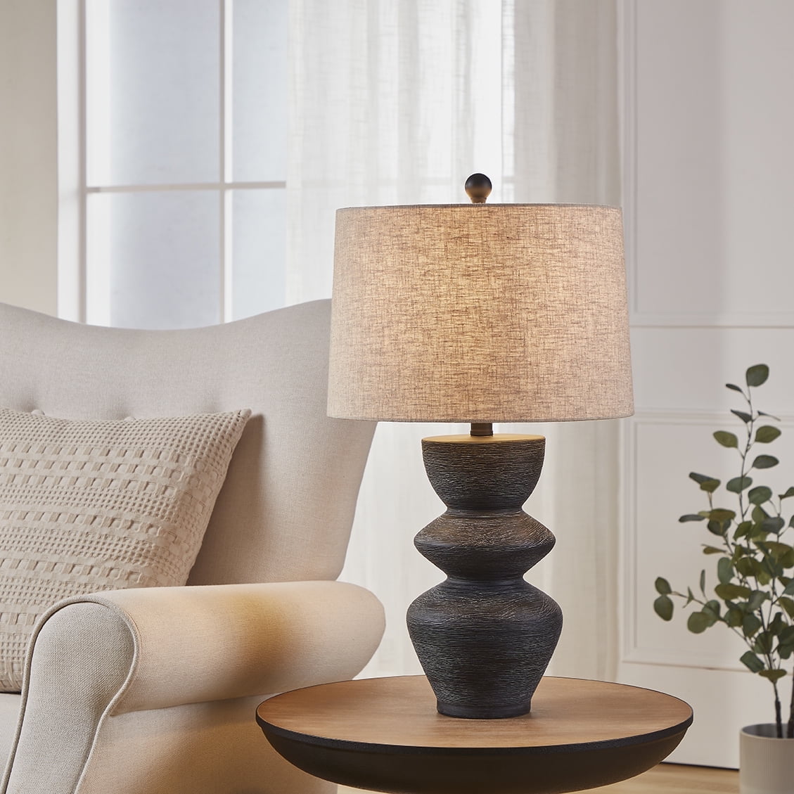 Kawoti 25" Black Distressed Ceramic Table Lamp with Beige Shade