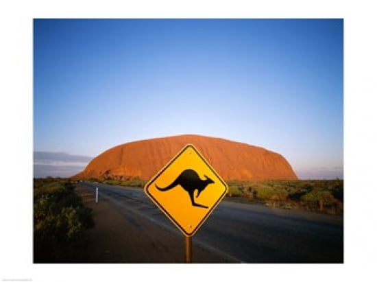 Kangaroo sign on a road with a rock formation in the background Ayers Rock Canvas Art - (24 x 18)