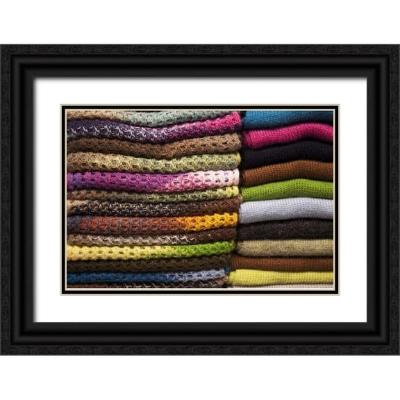 Kaveney, Wendy 24x17 Black Ornate Wood Framed with Double Matting Museum Art Print Titled - Peru, Aguas Calientes Stack of textile of wool