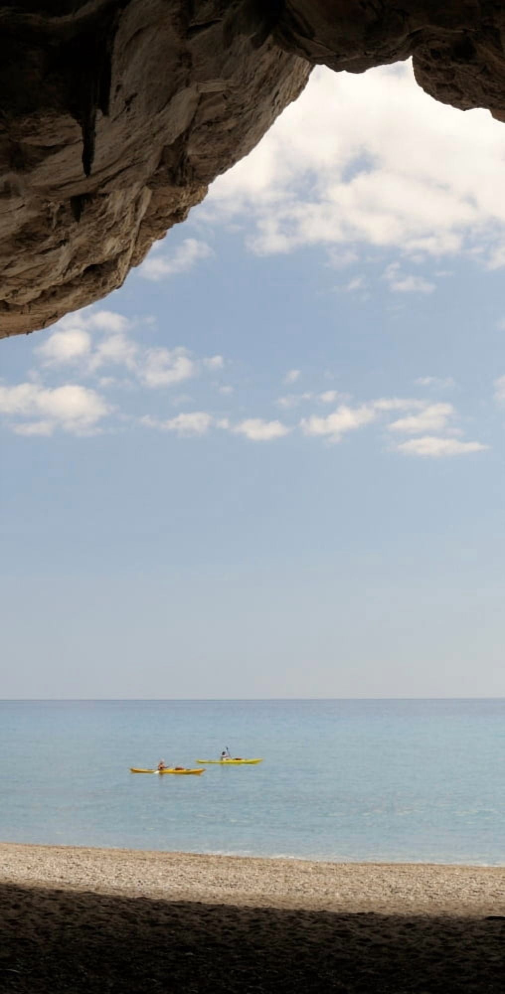 Kayak in the sea viewed from cave Cala Luna Beach Cala Gonone Nuoro Sardinia Italy Canvas Art - Panoramic Images (12 x 36)