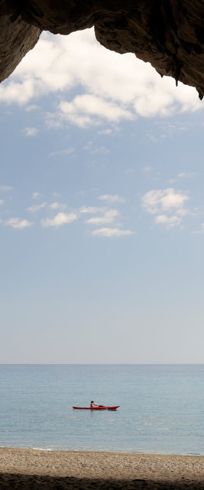 Kayak in the sea viewed from cave Cala Luna Beach Cala Gonone Nuoro Sardinia Italy Canvas Art - Panoramic Images (36 x 12)