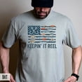 thumbnail image 1 of "Keepin' It Reel" Fishing Flag T-Shirt – Patriotic Angler & Lure Graphic Tee, 1 of 6