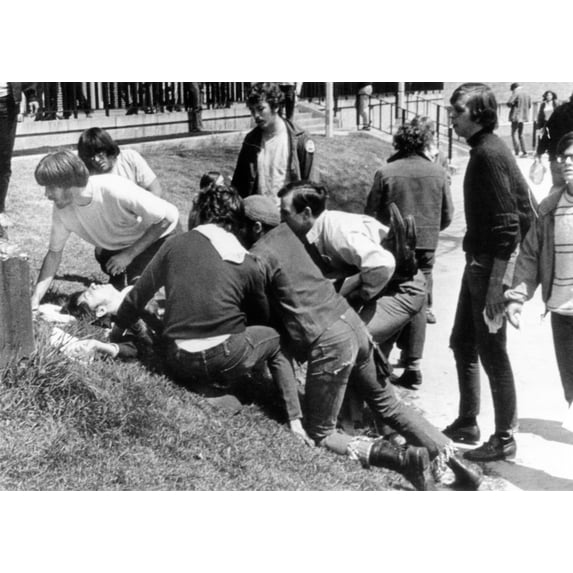 Kent State University Students Come To The Aid Of A Wounded Youth. He Was One Of 4 Students Killed And 9 Wounded When National Guardsmen Fired 67 Rounds In 13 Seconds Into A Crowd Of 500 Anti-Vietnam
