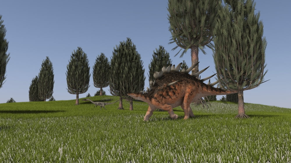 Kentrosaurus and a Coelophysis walking across an open field Canvas Art - Kostyantyn IvanyshenStocktrek Images (38 x 22)