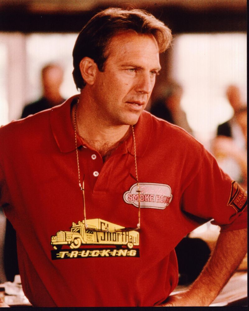 Kevin Costner Wearing Red Shirt With Hands On Hips In Tin Cup Photo