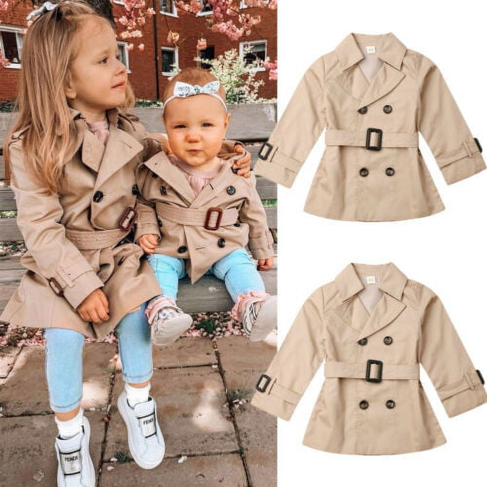 Baby in a store trenchcoat