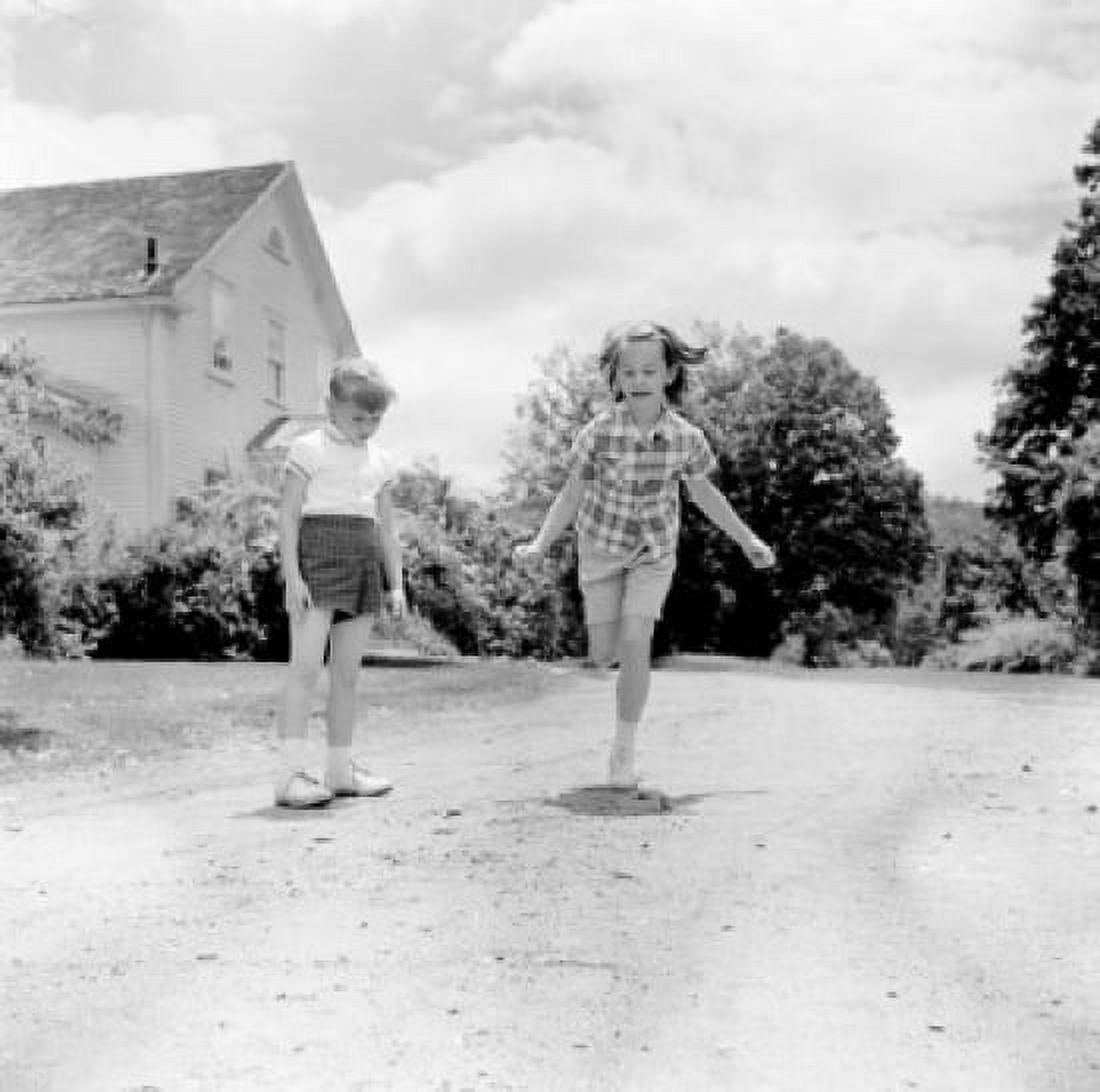 Kids playing on country road Canvas Art - (24 x 36)