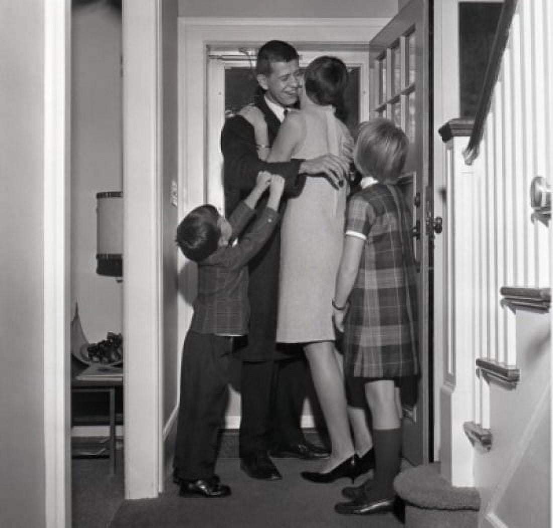 Kids with mother greeting father coming back home Canvas Art - (24 x 36)