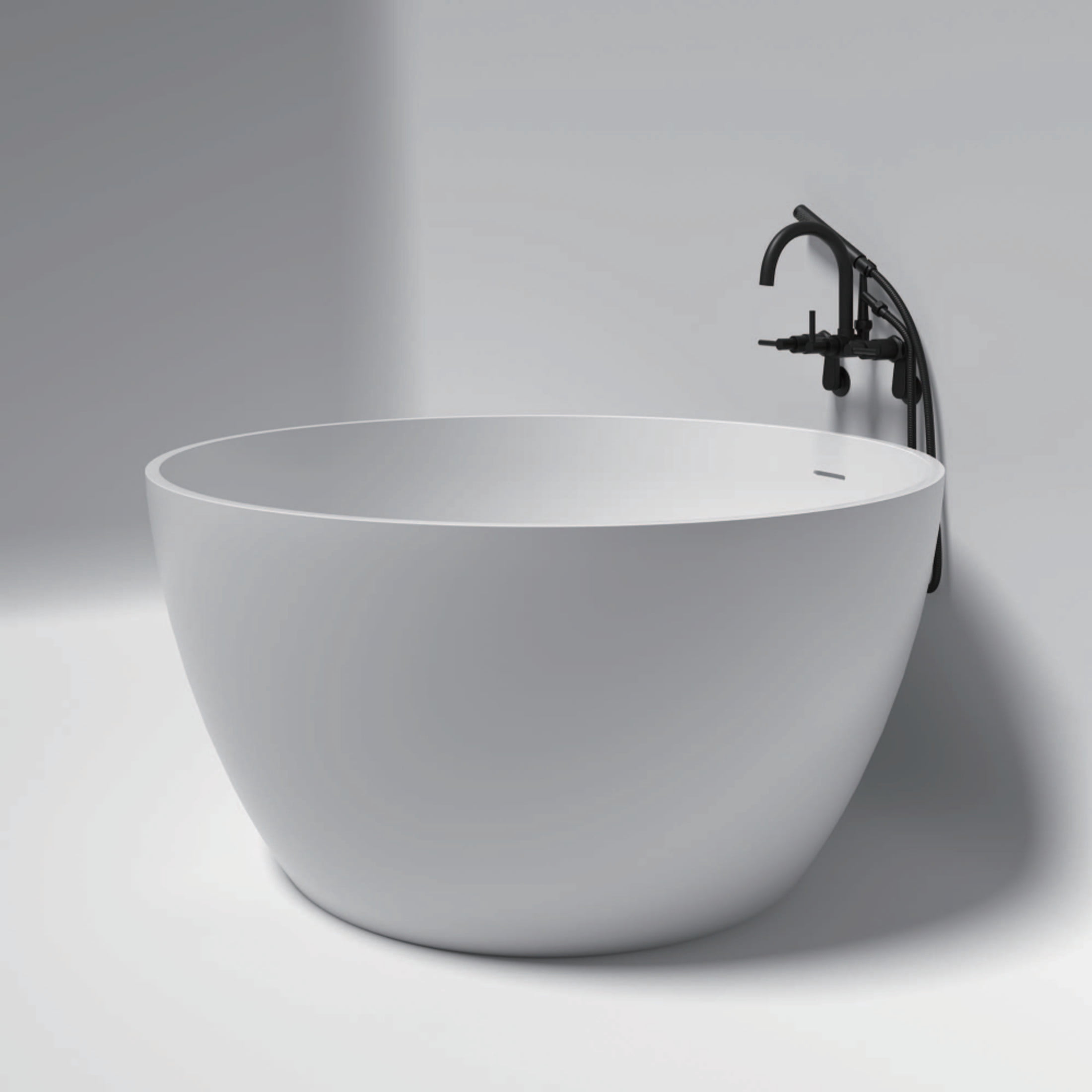 Kingston Brass KRTRO4545150DL 45-Inch Solid Surface Round Double Ended Freestanding Tub with Faucet Combo and Drain in Matte Black
