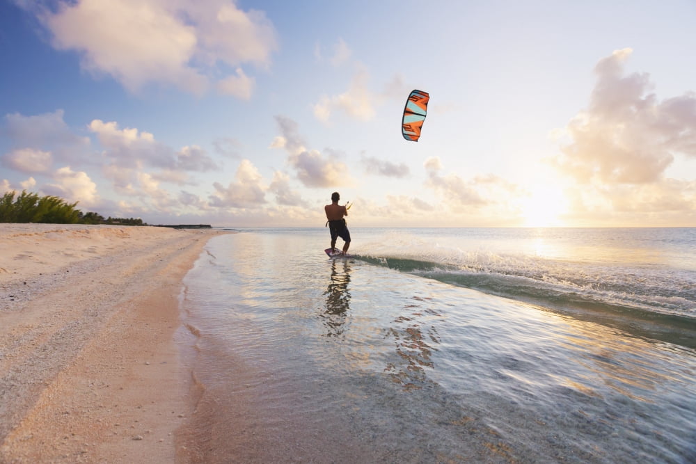 Kiteboarding in tropical lagoon in the South Pacific at sunset Tikehau French Polynesia Canvas Art - MakenaStockMedia Design Pics (19 x 12)