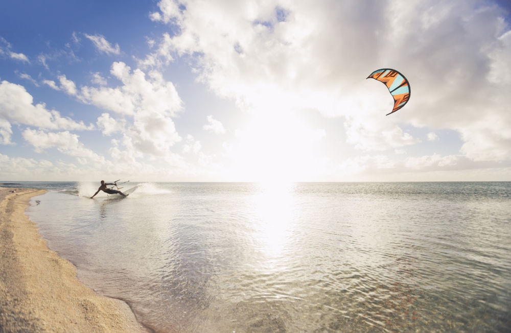 Kiteboarding in tropical lagoon in the South Pacific at sunset Tikehau French Polynesia Canvas Art - MakenaStockMedia Design Pics (19 x 12)