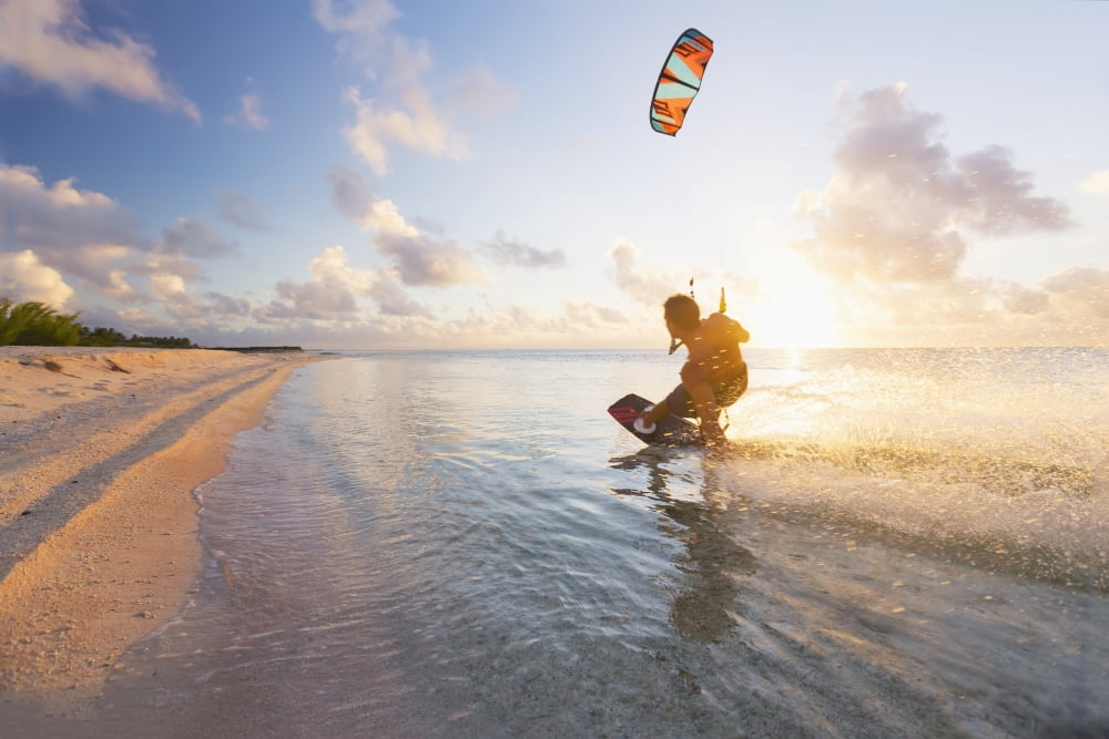 Kiteboarding in tropical lagoon in the South Pacific at sunset Tikehau French Polynesia Canvas Art - MakenaStockMedia Design Pics (38 x 24)