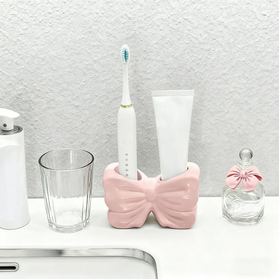 Kumdkd Bow Shaped Toothbrush Holder, Pink Resin Bathroom Counter Organizer with 4 Slots, Decorative Toothbrush Storage Rack for Sink, Kids Bathroom, and Family Bathroom Decor