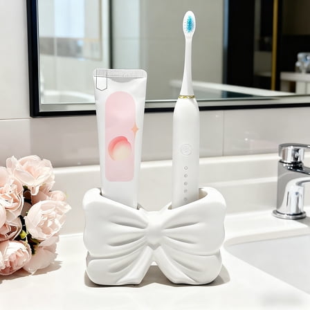 Kumdkd Bow Shaped Toothbrush Holder, White Resin Bathroom Counter Organizer with 4 Slots, Decorative Toothbrush Storage Rack for Sink, Kids Bathroom, and Family Bathroom Decor